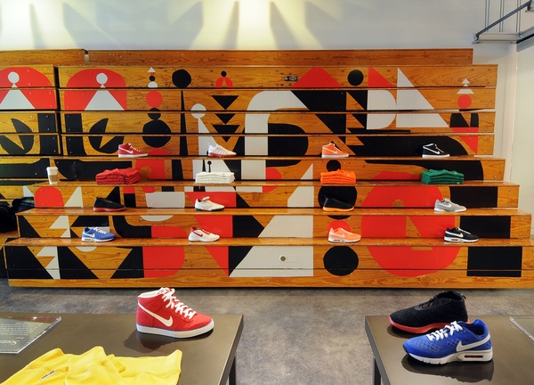 Cody Hudson design on the wood paneled display wall that doubles as pull-out bleachers for World Cup watch parties.
