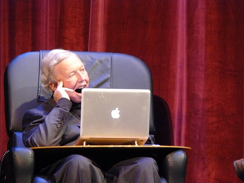 Roger Ebert and his talking computer. At one point, Ebert interjected the panelists\' heated conversation with a computer-voiced \"Cough, cough\" to get their attention.