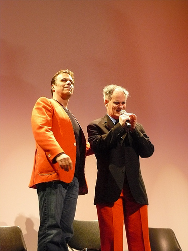 Film critic Richard Roeper and Vincent P. Falk of \"Vincent: A Life in Color\" tradnig suit jackets during the film\'s Q&A panel.