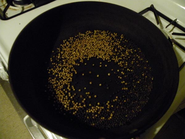 Toast the peppercorns and coriander seeds over medium-high heat.