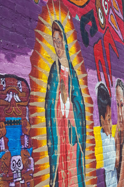 On the side of the Casa AztlÃ¡n building.