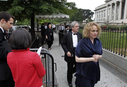 Kathryne Mudge, right, and her husband, Arturo A. Valenzuela, assistant secretary of state for Western Hemisphere Affairs, leave a checkpoint after discovering Mudge did not have her identification for the State Dinner at the White House. They returned about an hour later with the ID and were allowed into the event.