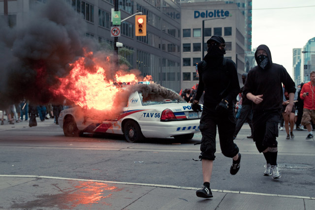 Burning police car. Video \<a href=\"http://torontoist.com/2010/06/live_g20_saturday.php#355PM-26\"\>here\<\/a\>