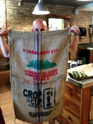 Friedman holds a bulk coffee bag, which will be turned into picnic sacks and shopping bags.