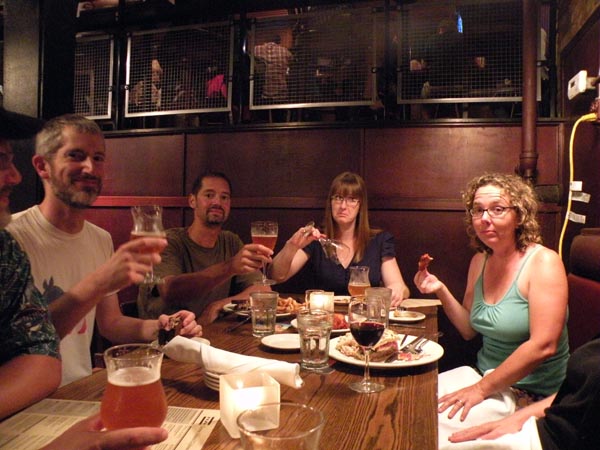 Todd Wiltse, Miguel Vallejo, Linda Rosul and Michelle Uting enjoy some food with their beer.