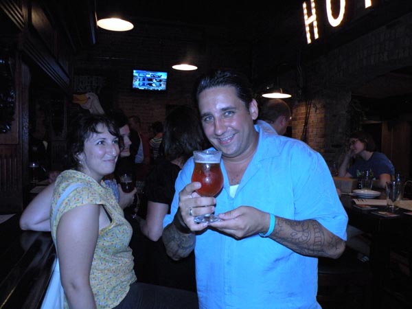 David Burke\'s Primehouse chef Rick Gresh poses with the beer as NBC Feast\'s Carly Fisher looks on.