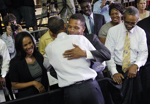 A man hug with Rep. Jesse Jackson Jr.