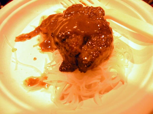 Paxton\'s short ribs braised with Rouben\'s Sgt. Peppercorn, served with puffed rice noodles.