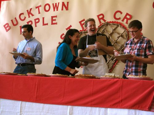 The finalist judges have a laugh (and a bite) on stage (Chicagoist/Kim Bellware)