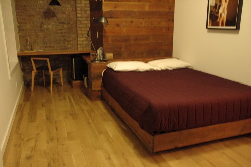 One of L&E\'s smaller rooms, still fit for two, houses a full size bed and a handmade desk