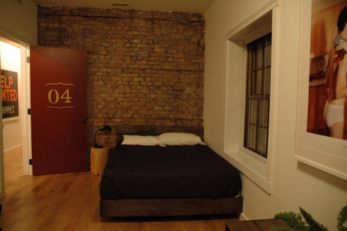 Each room has a unique wall of brick, new or reclaimed wood or covered with an art installation