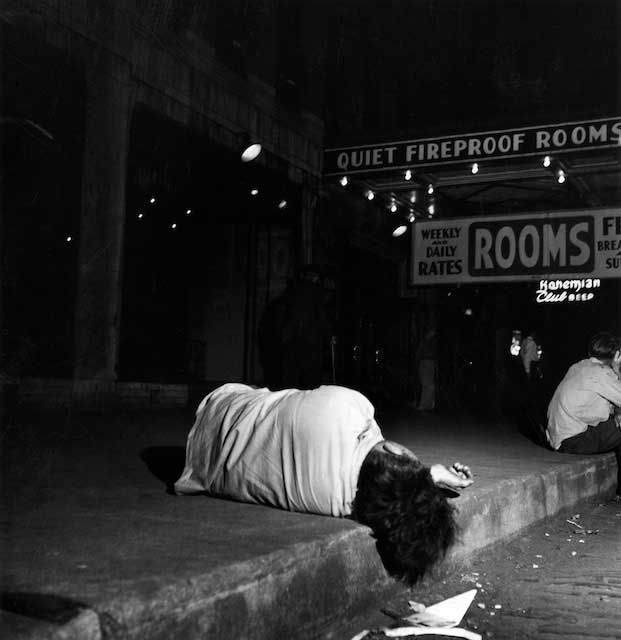One of the Madison Street bums who woke up looking at the cats, whose face seemed cut from the hindquarters of adversity, Too poor to pay the 75 cents a night lodging fee. Not when beer was a dime.