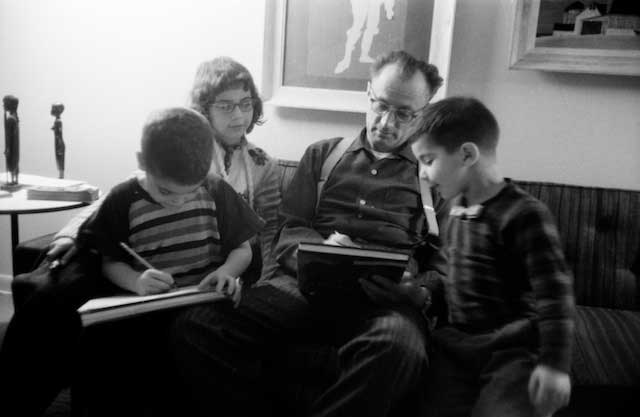 Before staying over on the couch in our Deerfield living room, in 1958, Nelson  enjoyed reading to and drawing cat pictures for my son Richard, right, my daughter Jane, rear, and for his godson Harmon, at left. Harmon would be murdered two weeks before his 2lst birthday in the Hippie haunts of Florida in 1972. The police have never solved the murder nor found his body.They explained that there were too many swamps, construction sites and alligators to make this feasible.