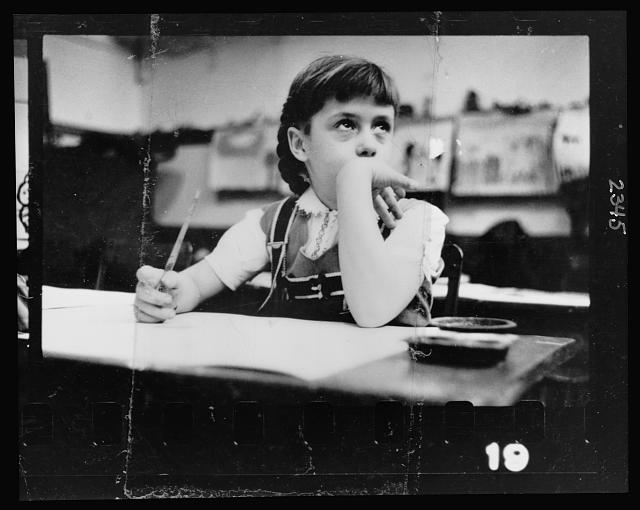 Young girl seated at desk in classroom in Chicago, Illinois