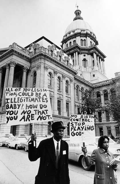 Literacy is important to many partisans.\r\nAlso to many voters. As in this picture in front of the Illinois Capitol Building, and in the next graffiti, a sign sometimes tells you more than you want to know about the bearer or artist.