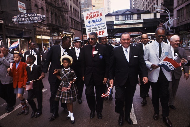 Political posturing was Mayor Daley\'s life\'s blood, as here with, I think, a Martin Luther King daughter.