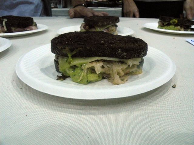 one sixtyblue\'s pastrami cured pork belly Reuben with housemade sauerkraut and ramp 1000 Island dressing.