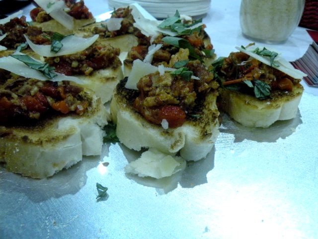 Bacon-inspired bruschetta with garlic goat cheese from redFLAME Pizzeria.