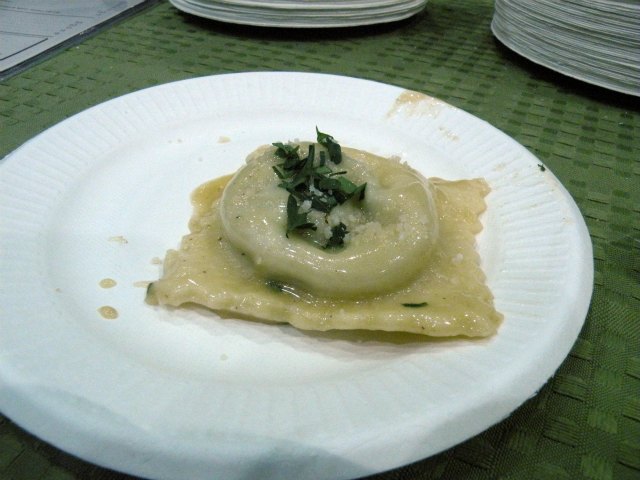 La Madia\'s spinach and bacon ravioli with bown butter sauce and parmesan.