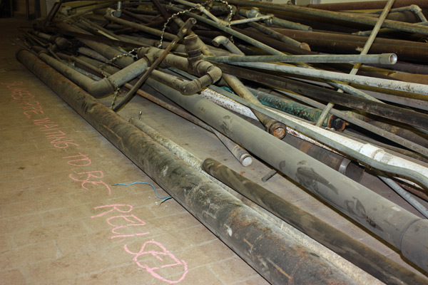 \"Salvaged pipes. Waiting to be reused\" at The Plant.