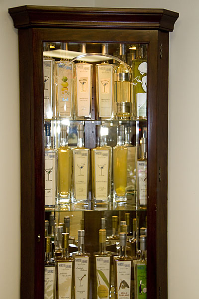 A display case shows off the first bottlings of every North Shore spirit to date.