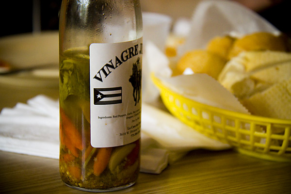 Borinquen\'s own infused vinegar, which goes great on the restaurant\'s rice with pigeon peas.