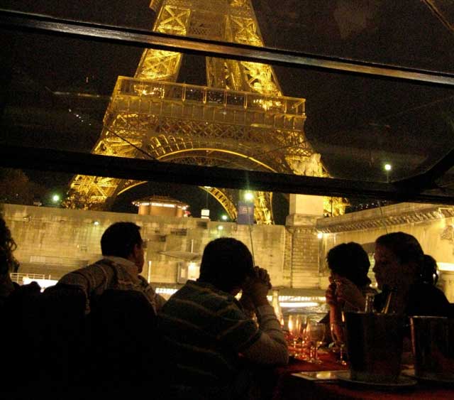 Our man-of-the-world pal Dan Blue, brought his girl friend up from New Zealand to attend my Paris opening. This is a dinner-hour close-up of the Eiffel Tower from one of the Seine River boats cruising Woody\'s spectacularly scenic movie. Florence and I feel this is Woody\'s best movie since \<i\>Annie Hall\<\/i\>. And thank him, also, for evoking our own experience of recent Paris in his masterpiece.