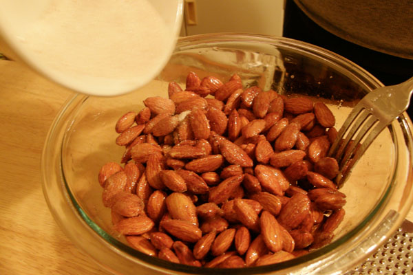 Evenly coat almonds with the sugar and cinnamon mixture
