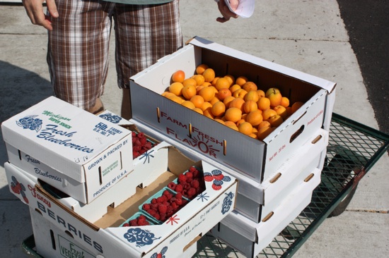 The cart is getting more and more full - apricots and berries on the top.