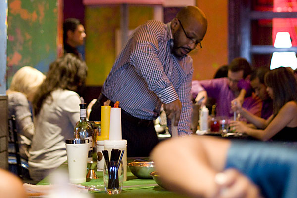 Carnivale\'s mixologist, Daryl Freeman, demos proper muddling - brief and gentle - for us Mojitos 101 classmates.