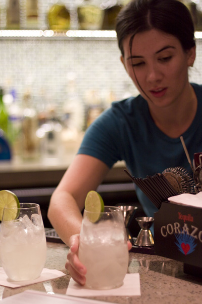Bartender and HUM brand ambassador Jenny Kessler serves a couple of Masa Azul cocktails.
