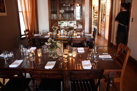 The interior of the dining room, set for service.