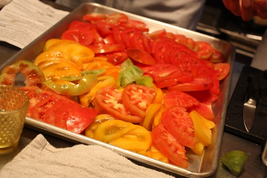 Heirloom tomatoes, ready to go into salad.
