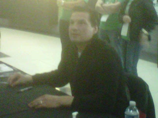 Eddie Olczyk signing autographs for lucky fans.