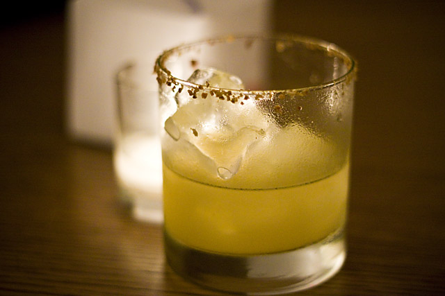 A sake, squash and yuzu cocktail, rimmed with toasted and crushed pumpkin seeds.