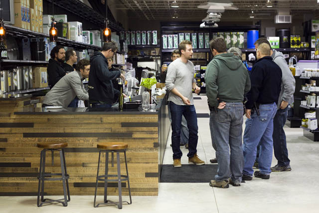 The massive, warehouse-sized store is staffed by knowledgeable homebrewers and gardeners, such as Sean Ittel (center, in gray shirt).