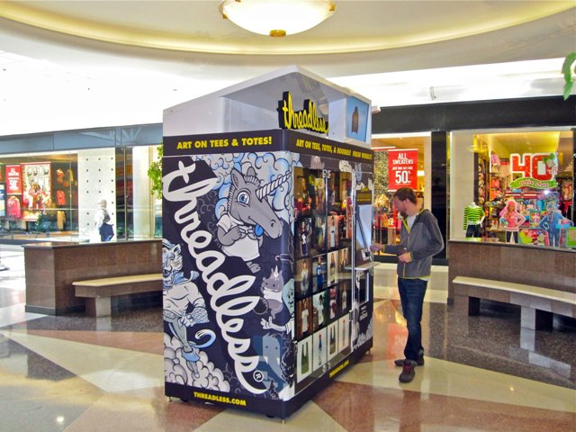 Threadless founder Jake Nickell tests a Threadless vending machine in Yorktown Mall. Image Credit: Wilson Fong/Threadless