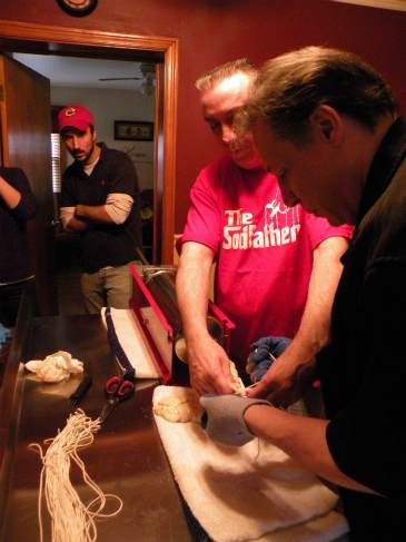 Balestri and Phillip Speciale tie knots into the beef intestinal casings. (Chuck Sudo/Chicagoist)
