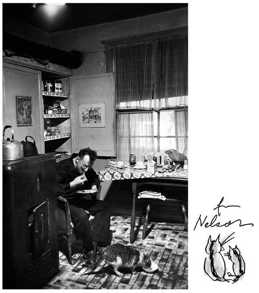 My friend, the great writer Nelson Algren, liked to dine with his randy cat Doubleday, facetiously  named after  the  publishing house he felt was screwing him one way or another. This was the main room of his 10 buck a month Chicago apartment at 1523 W. Wabansia in 1949. The bathless flat, into which the great Simone de Beauvoir moved, appears more or less as you see it in her lousy novel about her romance with Nelson, The Mandarins which, in a scandalous vote, won the Prix Goncourt for French literature. To foisted on a fictional  doctor and his  own Simone.To  Nelson\'s hurt consternation. It was a, um, blow by blow account of their affair that Nelson reviewed as going down \"like eating cardboard.\" He also accused her (she was really Jean-Paul Sartre\'s lifetime lady) of invading her own privacy. He told me she phoned him in tears after reading his review in the Parisan Review as I recall, asking him, \"Didn\'t you love our love-making( etc.)?\" He said, \"I told her, over her sniffling, that I wasn\'t reviewing the fucking, which was great. I was reviewing the fucking book.\" She had, adding to his embarrassment, let it be known in haute Paris that he had given her her first orgasm. She was then pushing 40, so it passed as big Gallic news. (Â© Art Shay)