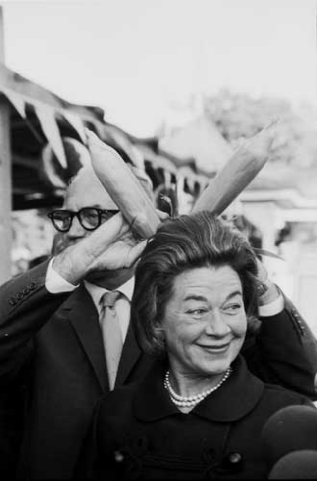 Barry Goldwater, campaigning with wife Margaret Johnson in Rockford in 1964. Time and then \<em\>Playboy\<\/em\> printed Barry\'s try at a semi-pornographic bunny joke. My favorite, probably apocryphal, Goldwater joke came when he was a younger candidate for Congress and (presumably before Phoenix had become the Winter Capital of Rich Jews in Northern Cities) the management of a golf course, hewing to their rules of restriction, attempted to keep Goldwater from teeing off because he was reportedly born Jewish. Teed off but smiling, Goldwater is reputed to have said, \"I\'m only half-Jewish, my mother was a shiksa&mdash;so  can I play nine holes?\" There was no Charlie Rose in those days to ask him outright about this canard. And, come to think of it no Charlie Rose to defend his own  name from being considered Jewish, either. In the bare-knuckled hustings of that day. Like maybe Rosenberg?  (Â© Art Shay)\r\n