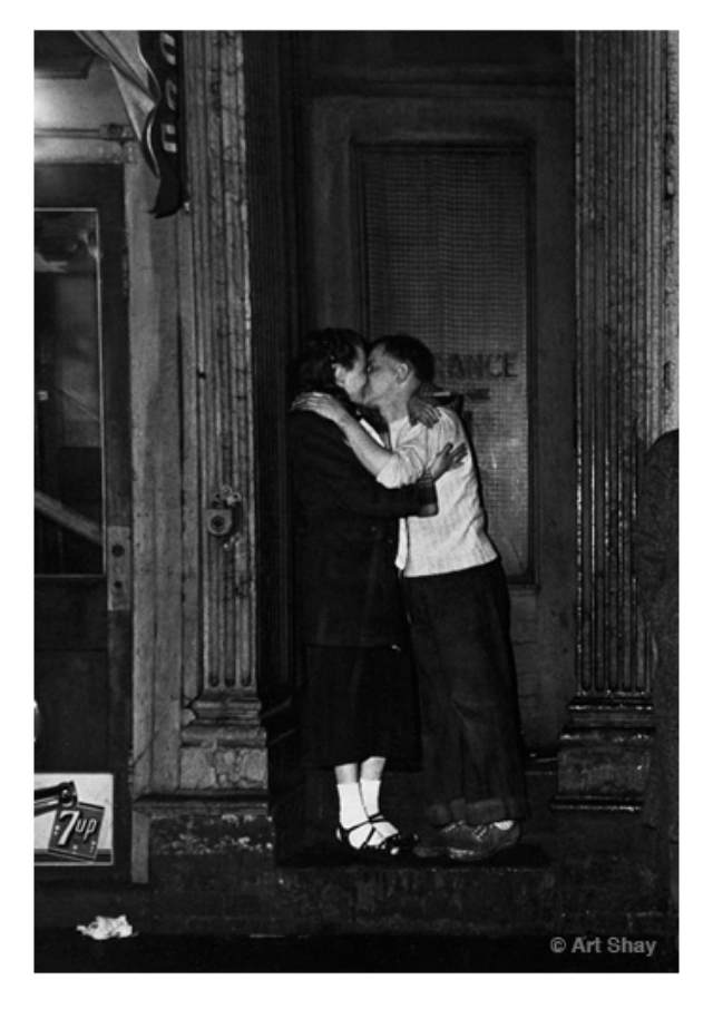A few blocks away and a few decades back on Clark Street, this couple left their drinks inside and fed their stronger appetites for each other outside. My archivist Erica, somewhat enigmatically adds, \"I love that this says entrance but suggests romance on the door.\"