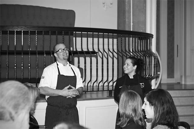 Chefs Jared Van Camp and Stephanie Izard introduce their dishes to the packed crowd at NellcÃ´te for the Eat to the Beat dinner thrown by WBEZ\'s \"Sound Opinions.\"