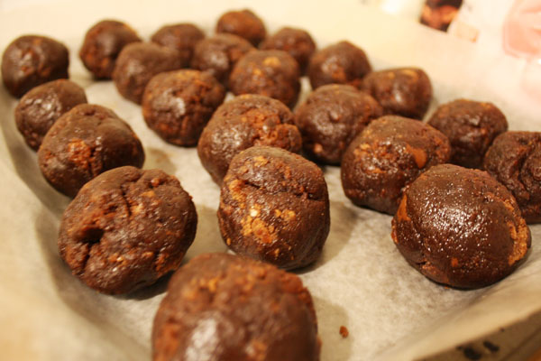 Form brownie mixture into balls for brownie pops
