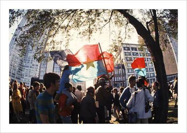 Parading against our country\'s increasing militarism, the Hippies lofted Vietnamese flags and anti-war posters. (Â© Art Shay)\r\n