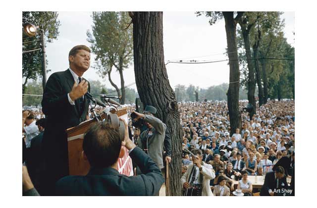 JFK\'s specialty was the impromptu address; he gloried in it. That Bell & Howell movie camera within five feet of his head could have sequestered a bomb or gun easily.