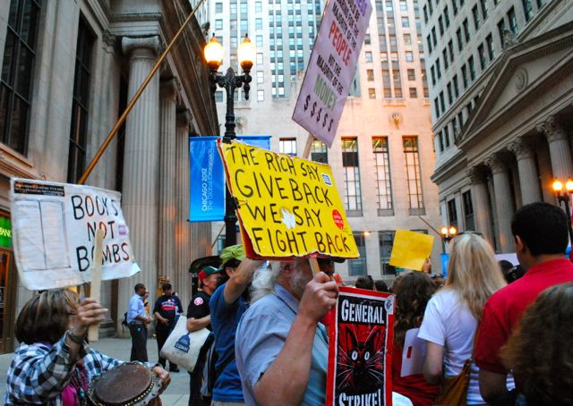 The CTU rally joins a group of protesters rallying against the Chicago Mercantile Exchange.