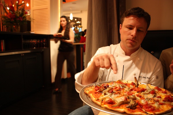 Chef Des Rosiers explains his pizza.