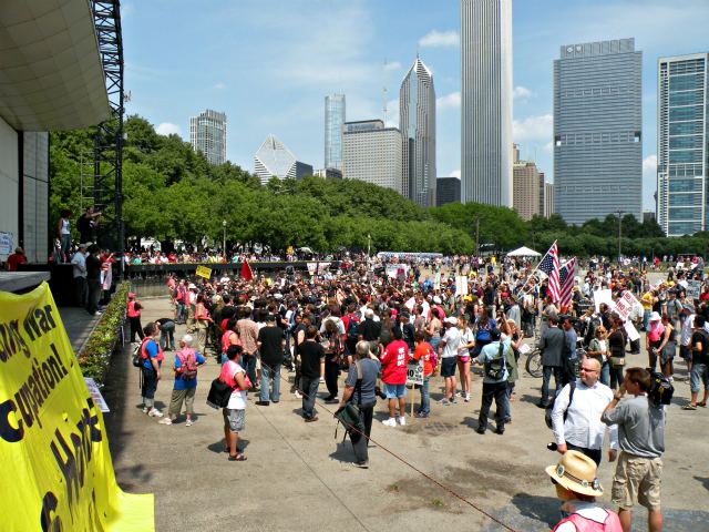 Protesters form a circle around Tom Morello.