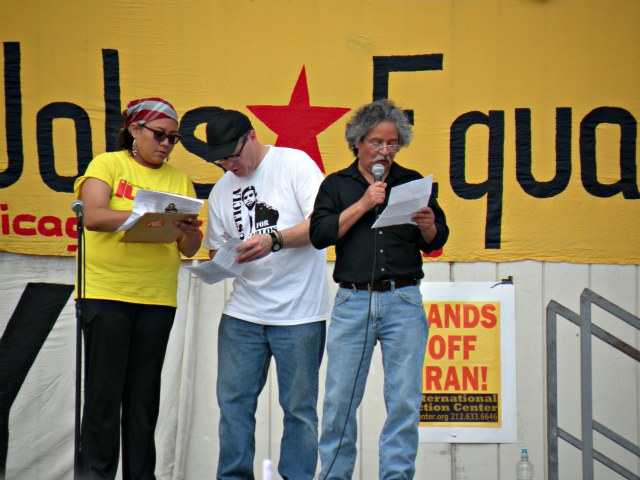 Martin Unzueta of Chicago Community and Workers Rights (right) addresses the crowd at the beginning of the rally.