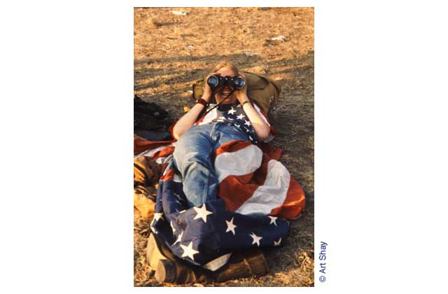 Half costume, half shelter against the cold ground and the night air, this young patriot camped out all Flag Day night.\r\n
